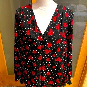 Elle black with white polka dots and red flowers